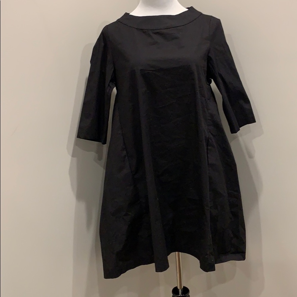 Black dress with pleats in the back